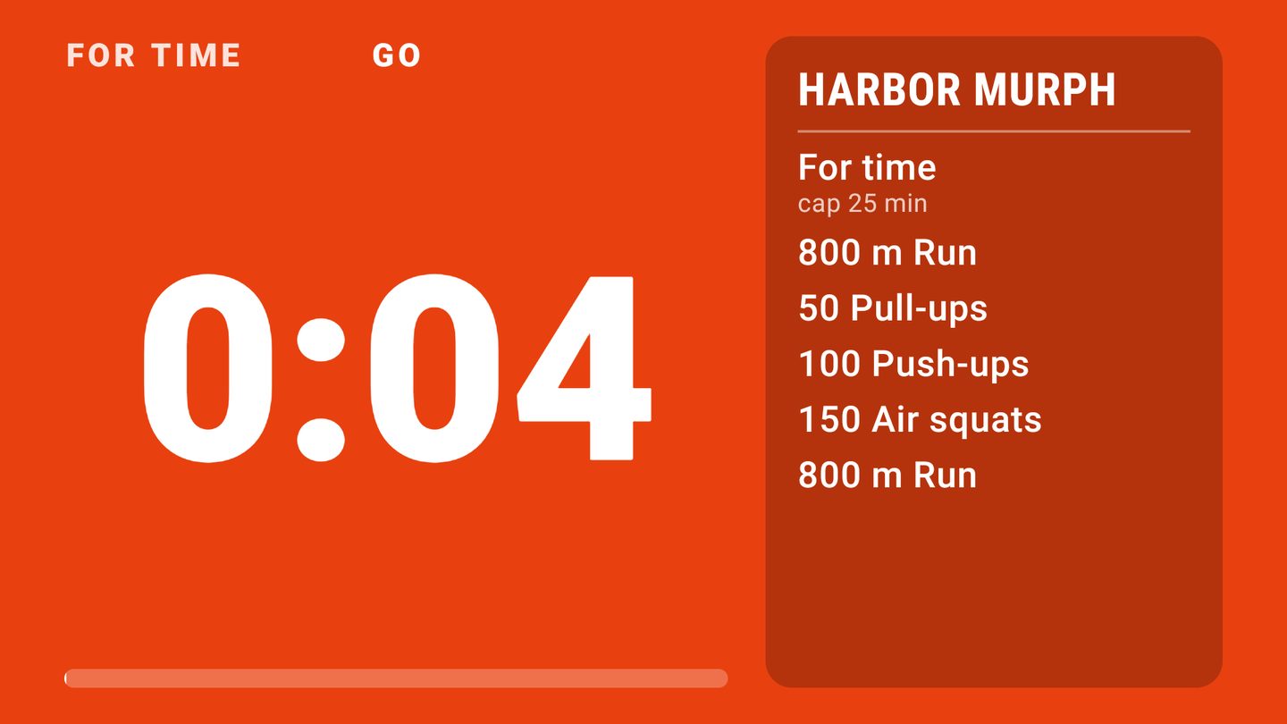 A Fire TV showing a For Time class timer next to the workout: 800 m run, 50 pull-ups, 100 push-ups, 150 air squats, 800 m run